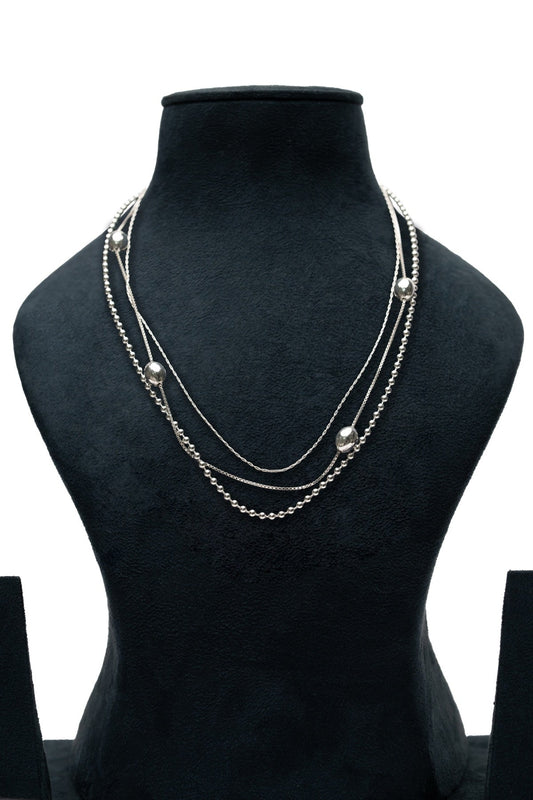 Orbit Layer Necklace – silver triple-layer necklace with mixed chain types and spaced round beads
